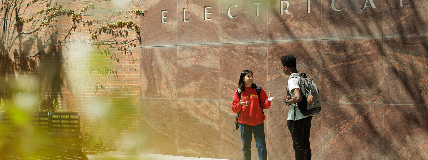 students outside the east entrance of Coover Hall